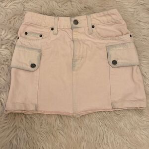 CARMAR Los Angeles distressed pink denim mini skirt with wrap around hip pockets